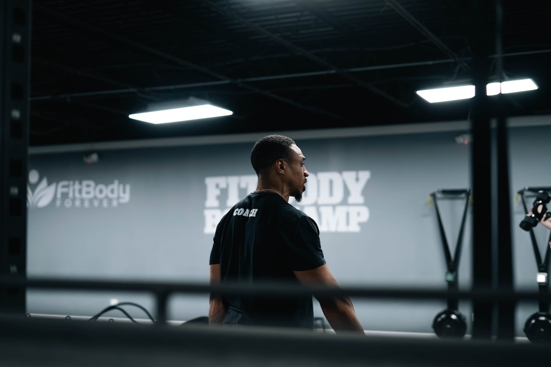 Coach leading a high-energy group kettlebell workout